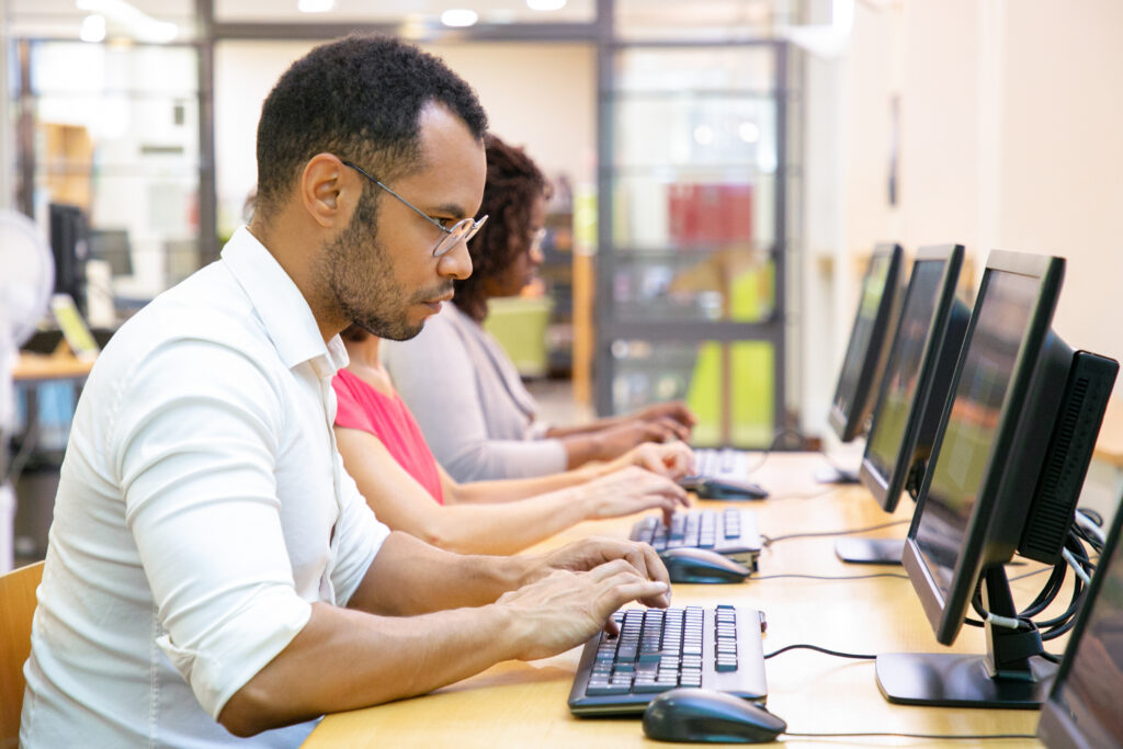 Extremely focused male student taking online test